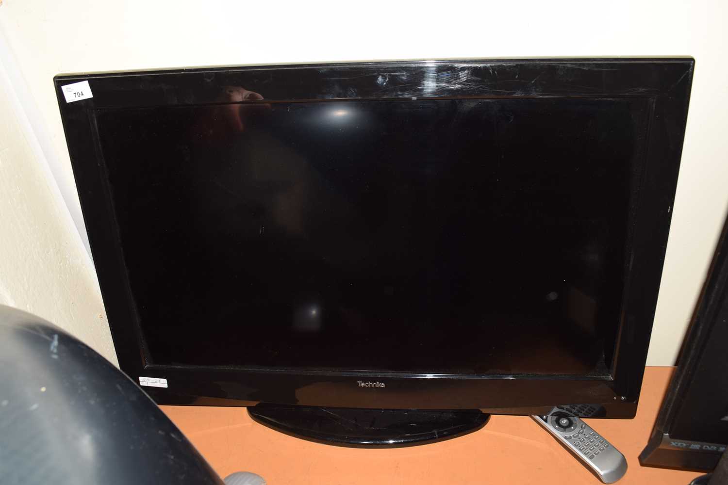 Lot 704 - SMALL TECHNIKA FLAT SCREEN TV