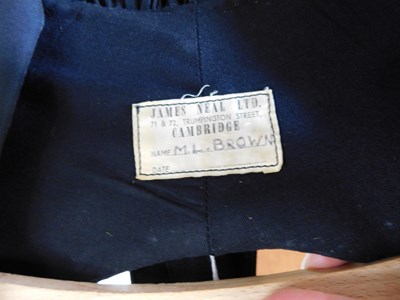 Lot 228 - An academic gown, the open fronted black robe...