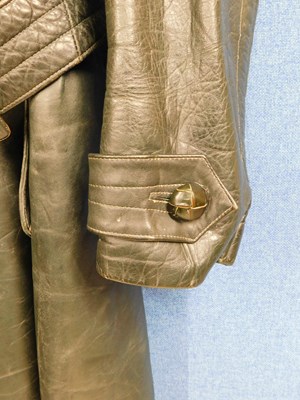 Lot 227 - A post WWII German dark green leather belted...