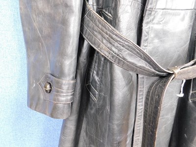 Lot 227 - A post WWII German dark green leather belted...
