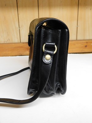 Lot 138 - A black leather cross body/shoulder bag by...