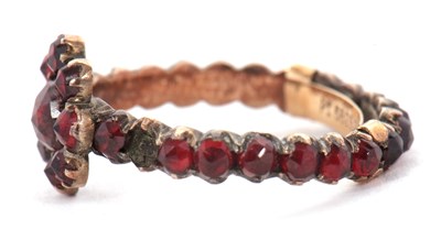 Lot 22 - A garnet ring, with garnet cluster to centre...