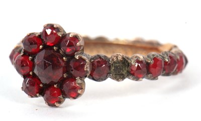 Lot 22 - A garnet ring, with garnet cluster to centre...