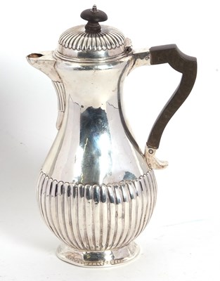 Lot 11 - A Victorian Scottish silver hot water jug of...