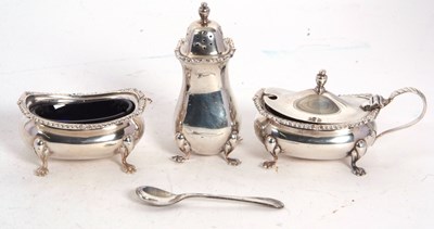 Lot 78 - An Elizabeth II silver three piece condiment...