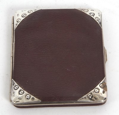 Lot 79 - A vintage leather walllet, the corner mounts...