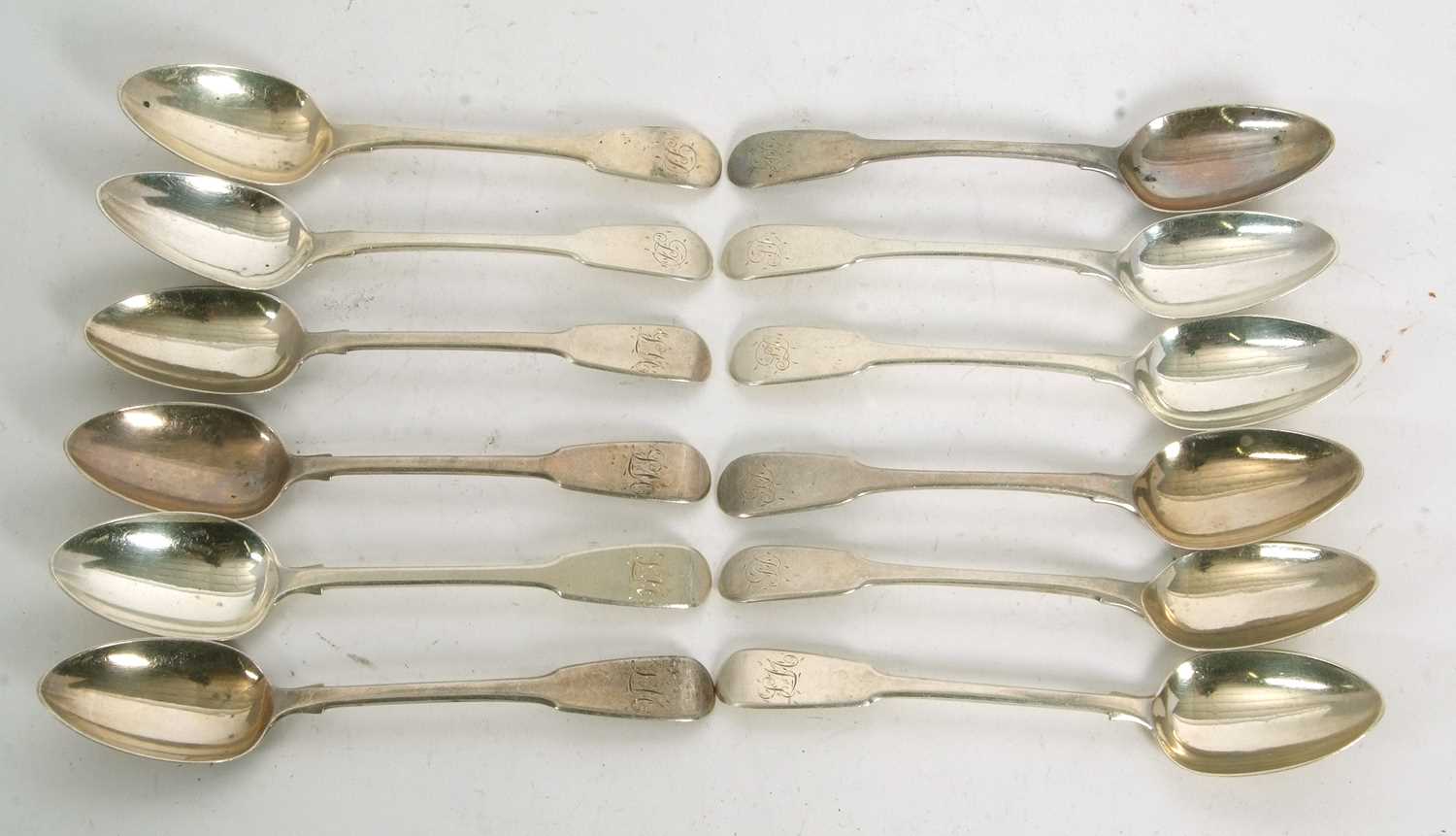 Lot 85 - Twelve George IV silver fiddle pattern...