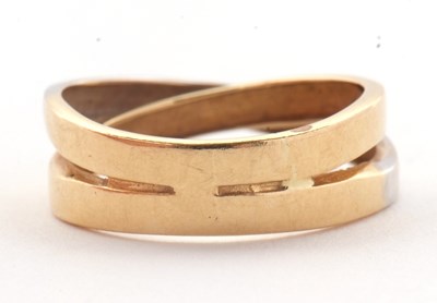 Lot 26 - A two tone gold ring, the white and yellow...