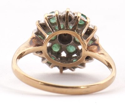 Lot 4 - A 9ct emerald and diamond cluster ring, set...