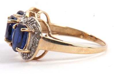 Lot 60 - A 9ct sapphire and diamond ring, the three...