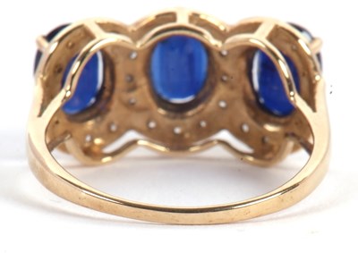 Lot 60 - A 9ct sapphire and diamond ring, the three...