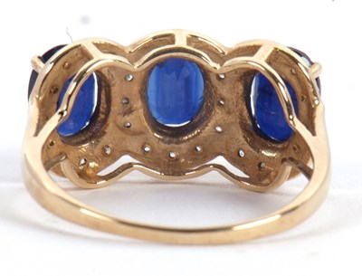 Lot 60 - A 9ct sapphire and diamond ring, the three...