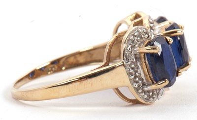 Lot 60 - A 9ct sapphire and diamond ring, the three...