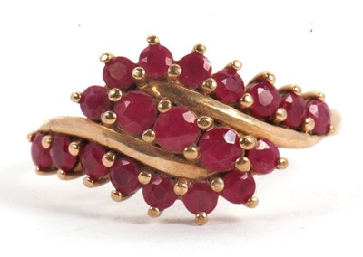 Lot 49 - A 9ct ruby ring, with three crossover style...