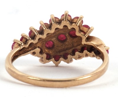 Lot 49 - A 9ct ruby ring, with three crossover style...