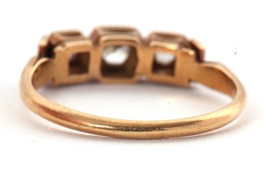 Lot 17 - A three stone diamond ring, the three slightly...
