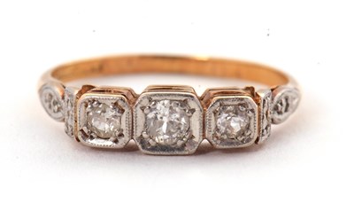 Lot 17 - A three stone diamond ring, the three slightly...