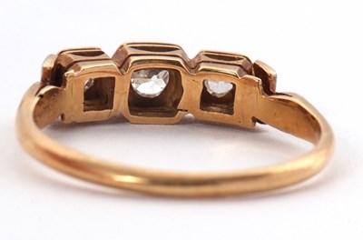 Lot 17 - A three stone diamond ring, the three slightly...