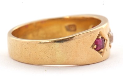 Lot 28 - A ruby and diamond ring, the 7mm deep band...