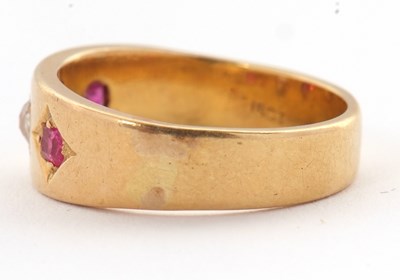 Lot 28 - A ruby and diamond ring, the 7mm deep band...