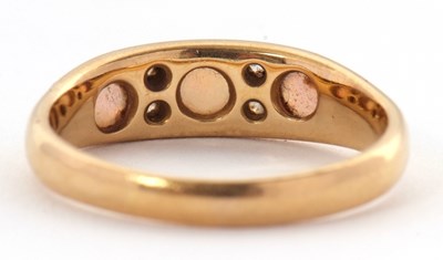 Lot 27 - An 18ct opal and diamond ring, set with three...