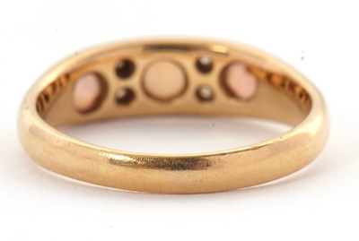 Lot 27 - An 18ct opal and diamond ring, set with three...