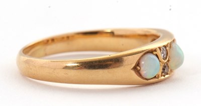 Lot 27 - An 18ct opal and diamond ring, set with three...
