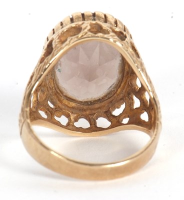 Lot 51 - A 9ct smokey quartz ring, the oval smokey...