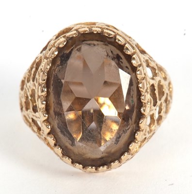 Lot 51 - A 9ct smokey quartz ring, the oval smokey...