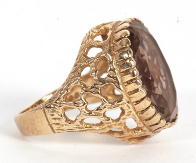 Lot 51 - A 9ct smokey quartz ring, the oval smokey...