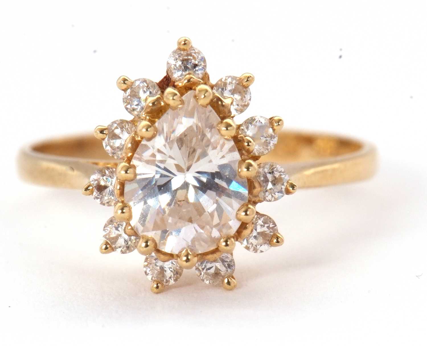 Lot 54 - A 14ct CZ ring, set with a pear shape cluster...