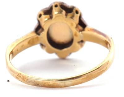 Lot 43 - An early 20th century opal ring, set with an...