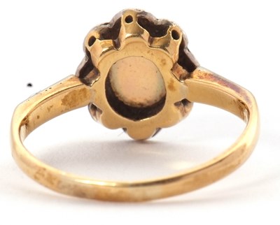Lot 43 - An early 20th century opal ring, set with an...
