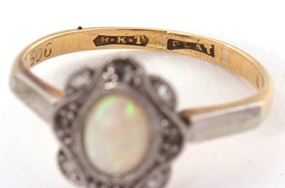 Lot 43 - An early 20th century opal ring, set with an...