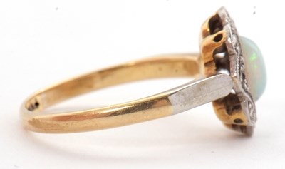 Lot 43 - An early 20th century opal ring, set with an...