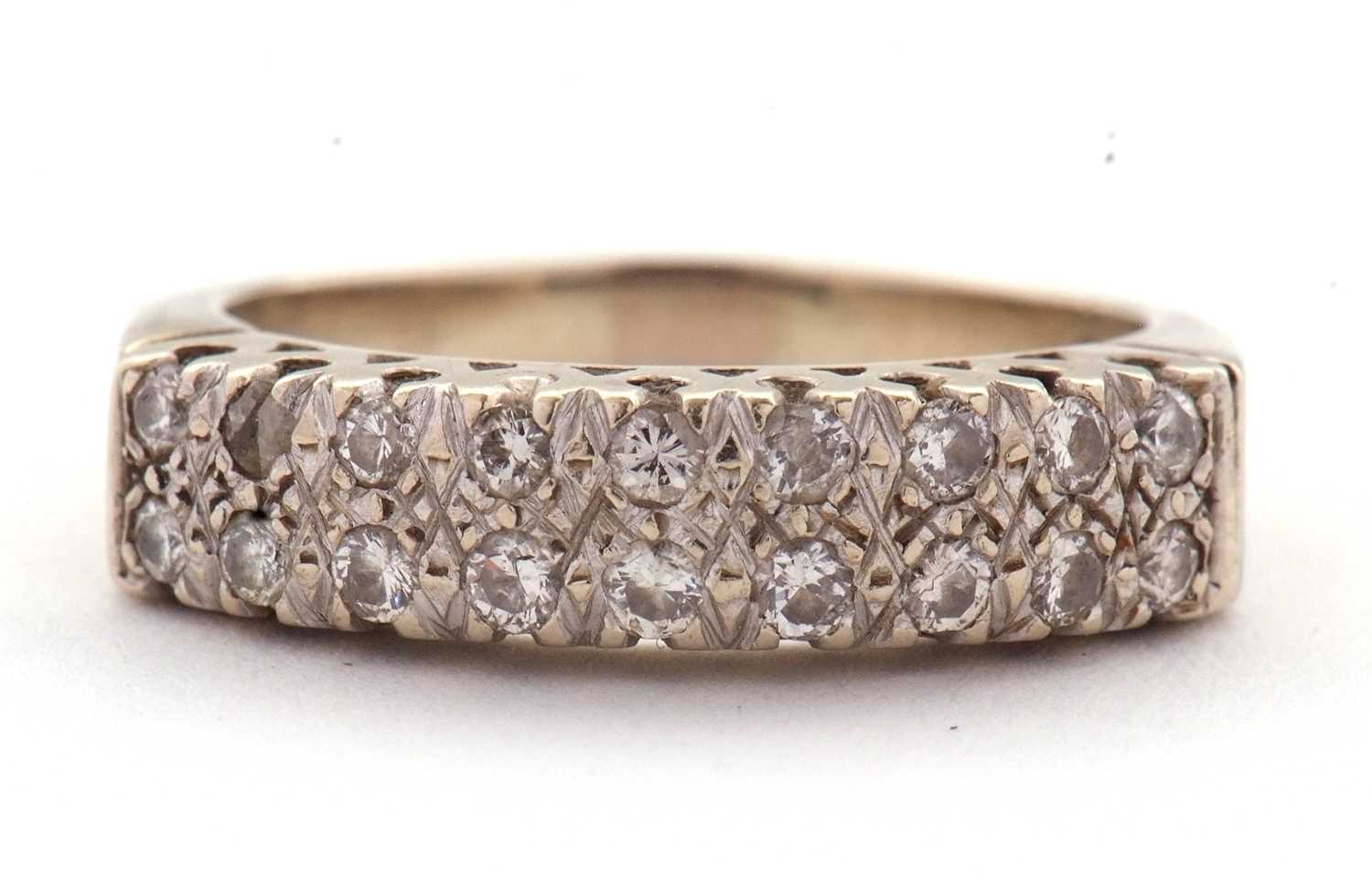 Lot 77 - An 18ct diamond ring, set with two rows of...