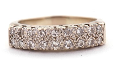 Lot 77 - An 18ct diamond ring, set with two rows of...