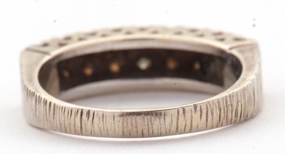 Lot 77 - An 18ct diamond ring, set with two rows of...