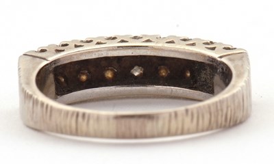 Lot 77 - An 18ct diamond ring, set with two rows of...