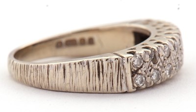 Lot 77 - An 18ct diamond ring, set with two rows of...