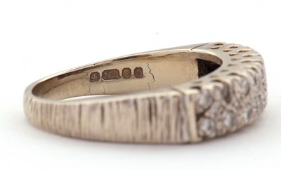 Lot 77 - An 18ct diamond ring, set with two rows of...