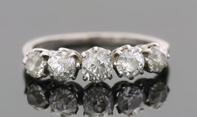 Lot 334 - A five stone diamond ring, the five graduated...