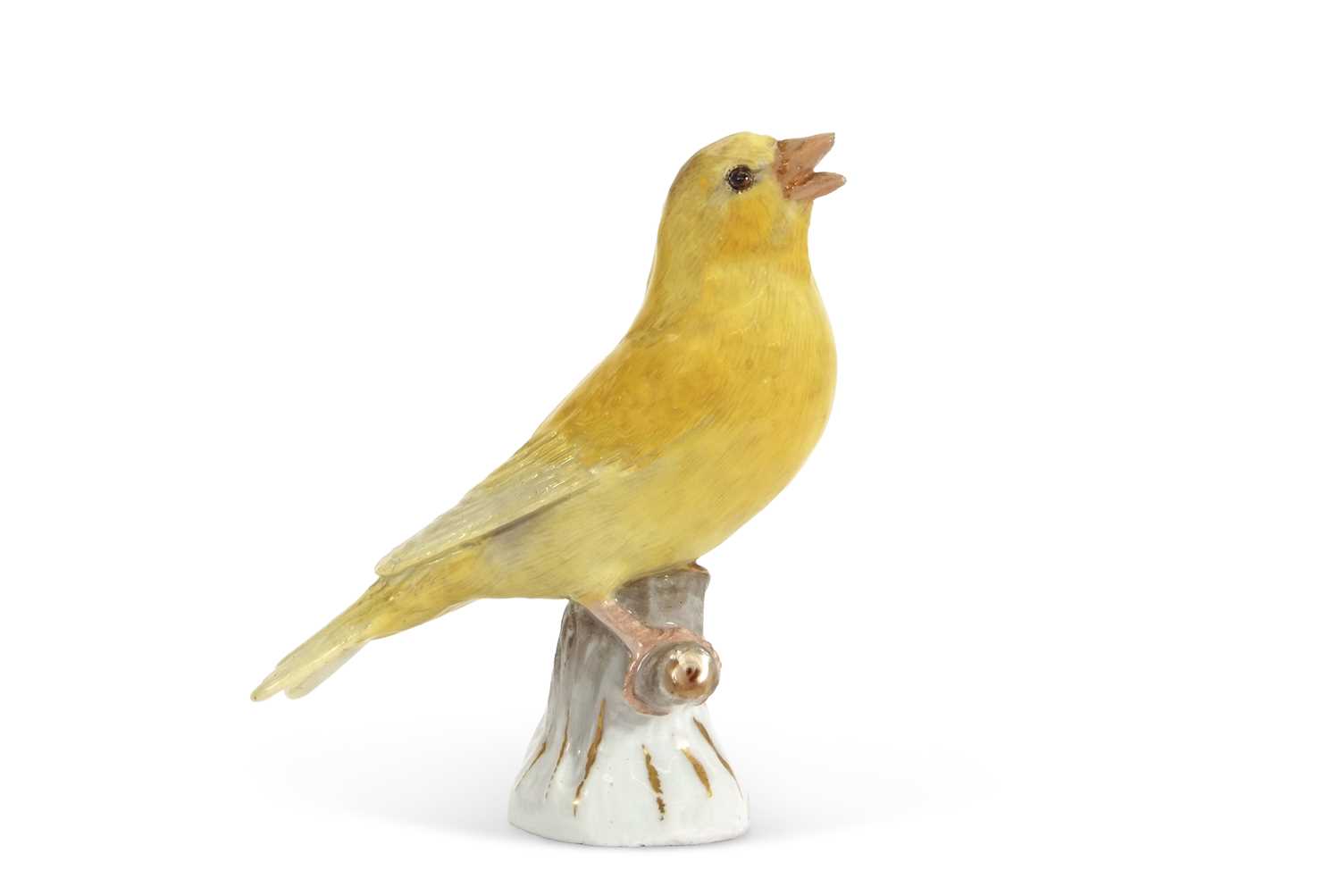 Lot 20 - A Meissen model of a canary perched on a tree...
