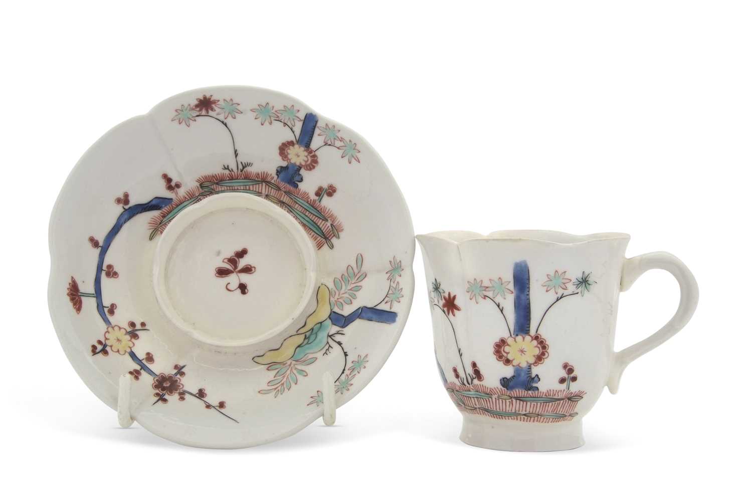 Lot 41 - A continental porcelain Trembleuse cup and...