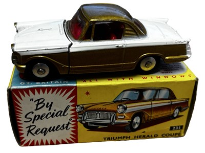 Lot 65 - A boxed Corgi 231 Triumph Herald Coupe in gold...