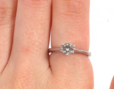 Lot 67 - An IGI certified diamond solitaire ring, the...