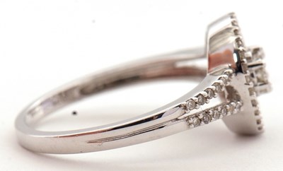 Lot 94 - A 9ct diamond ring, set throughout with round...