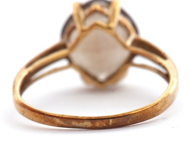 Lot 13 - A 9ct smokey quartz ring, the modified cushion...