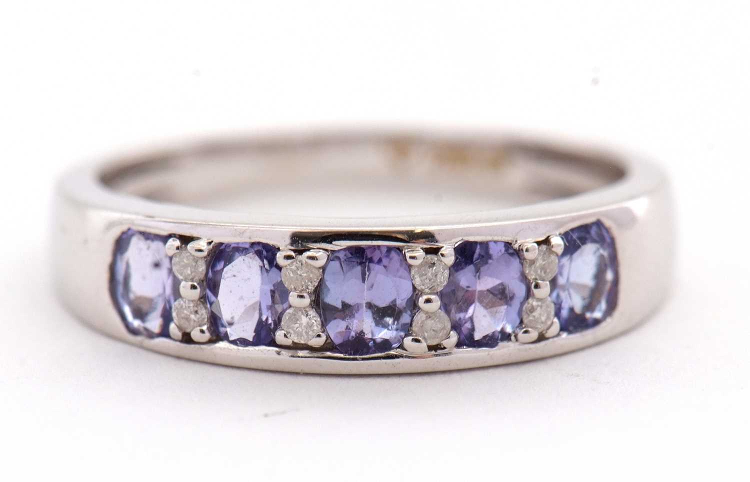 Lot 31 - An 18ct tanzanite and diamond ring, with...