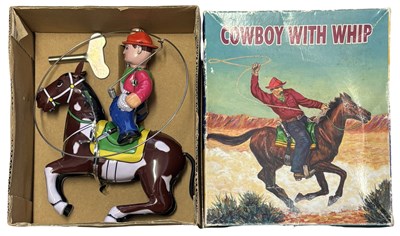Lot 199 - A boxed Chinese reproduction clockwork Cowboy...